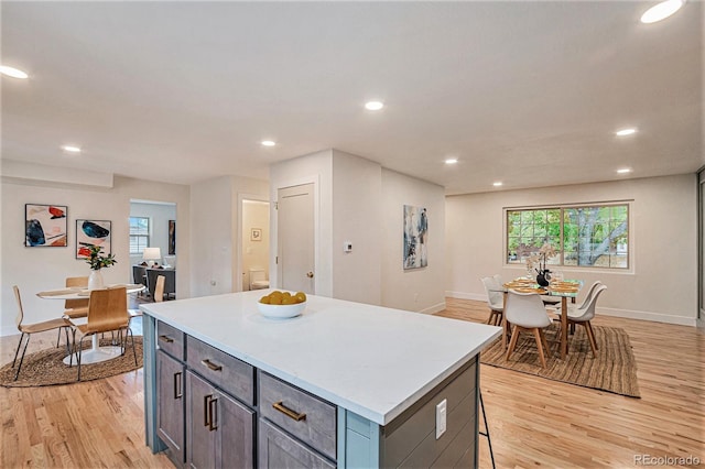 kitchen featuring a center island and light wood-type flooring