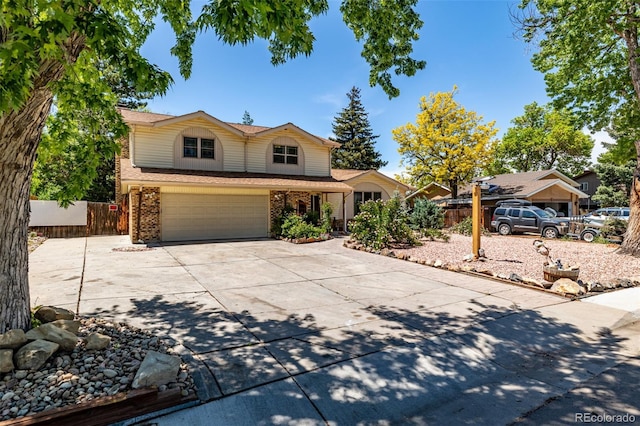 305 Titan St, Aurora, CO 80011 - traditional-style home featuring concrete driveway, brick siding, an attached garage, and a shingled roof