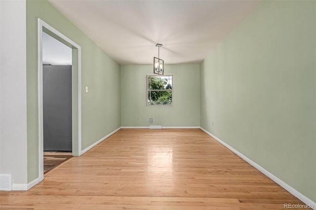 305 Titan St, Aurora, CO 80011 - unfurnished dining area featuring light wood finished floors and baseboards