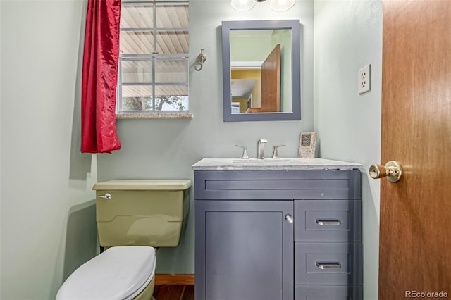305 Titan St, Aurora, CO 80011 - bathroom featuring vanity and toilet