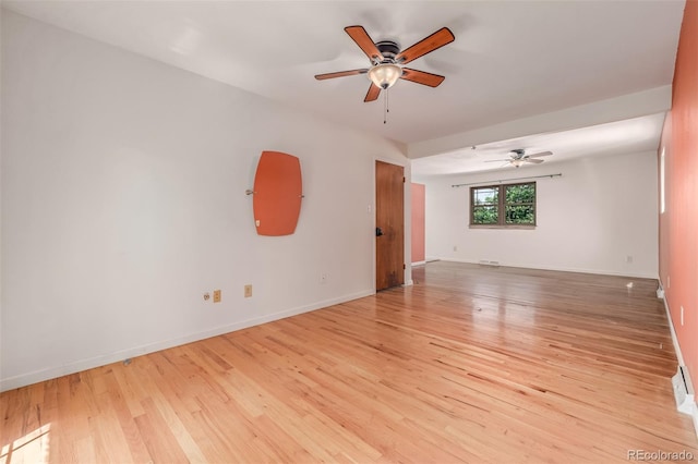 305 Titan St, Aurora, CO 80011 - empty room featuring ceiling fan, light wood-type flooring, and baseboards