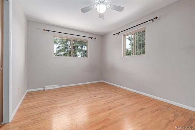 305 Titan St, Aurora, CO 80011 - empty room featuring healthy amount of natural light and light wood-type flooring