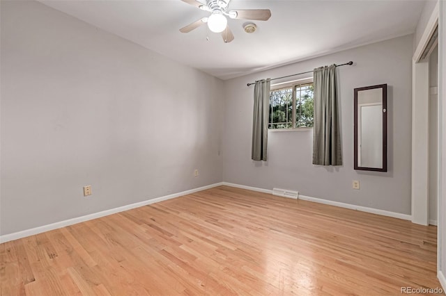 305 Titan St, Aurora, CO 80011 - unfurnished room featuring light wood-type flooring, a ceiling fan, baseboards, and a smoke detector