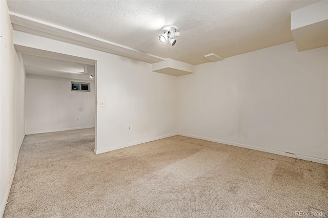 305 Titan St, Aurora, CO 80011 - empty room featuring carpet floors, a textured ceiling, and baseboards