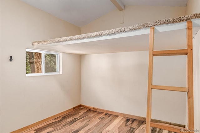 305 Titan St, Aurora, CO 80011 - below grade area with light wood finished floors and baseboards
