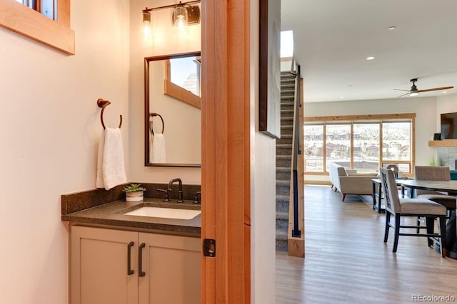148 Hay Meadow Dr, Fraser, CO 80442 - bathroom with wood finished floors, a ceiling fan, vanity, and recessed lighting