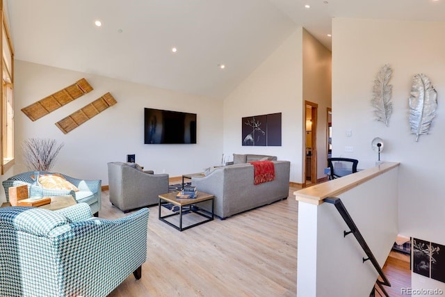 148 Hay Meadow Dr, Fraser, CO 80442 - living room featuring high vaulted ceiling, light wood finished floors, and recessed lighting