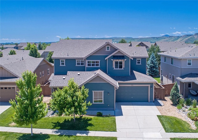 15378 W 50th Pl, Golden, CO 80403 - view of front of property with driveway, a residential view, roof with shingles, and an attached garage
