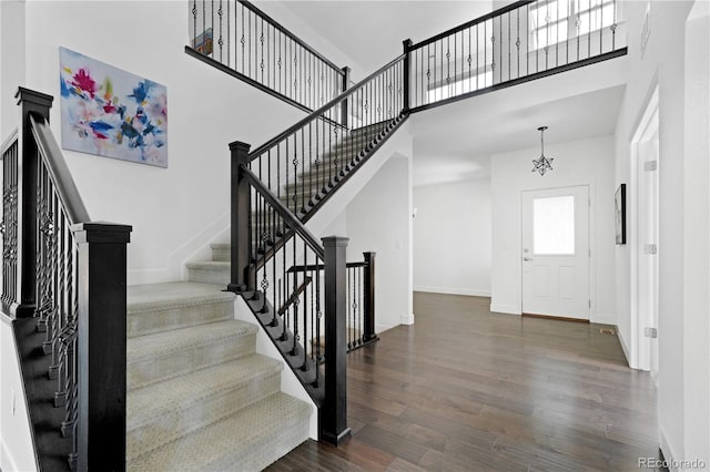 15378 W 50th Pl, Golden, CO 80403 - foyer featuring wood finished floors, a high ceiling, and stairs