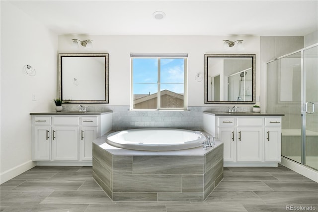 15378 W 50th Pl, Golden, CO 80403 - full bath featuring a stall shower, two vanities, and a garden tub
