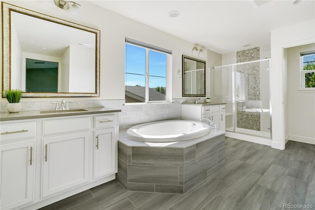 15378 W 50th Pl, Golden, CO 80403 - bathroom with a stall shower, a bath, and vanity