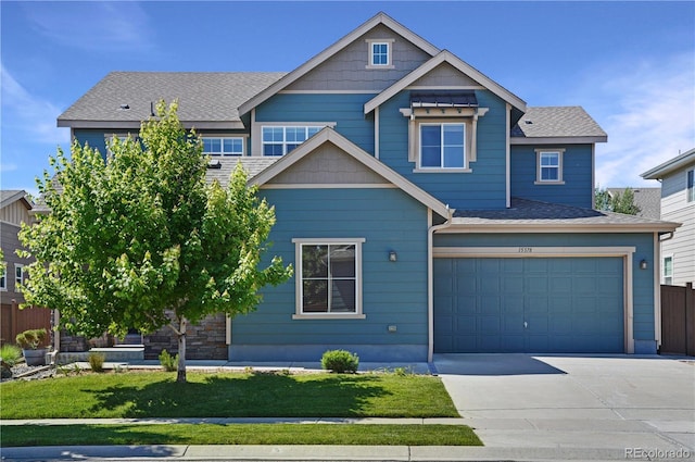 15378 W 50th Pl, Golden, CO 80403 - craftsman-style home featuring driveway, an attached garage, and a shingled roof