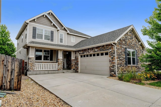 8071 Tabor St, Arvada, CO 80005 - craftsman house with a porch, stone siding, an attached garage, driveway, and a shingled roof