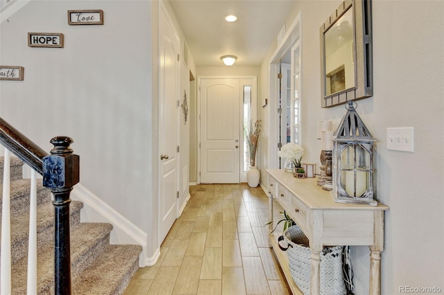8071 Tabor St, Arvada, CO 80005 - foyer with stairs and light wood-style floors
