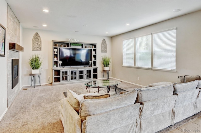 8071 Tabor St, Arvada, CO 80005 - carpeted living area with a fireplace and recessed lighting