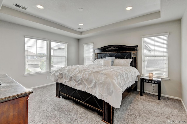 8071 Tabor St, Arvada, CO 80005 - bedroom featuring carpet flooring, a tray ceiling, multiple windows, and recessed lighting