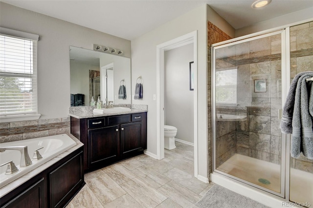 8071 Tabor St, Arvada, CO 80005 - bathroom with a stall shower, vanity, and a garden tub
