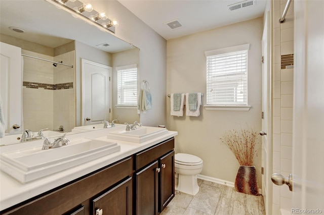 8071 Tabor St, Arvada, CO 80005 - bathroom with double vanity and a shower