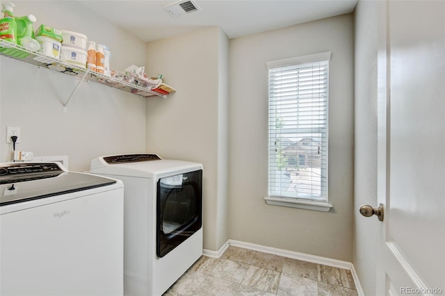 8071 Tabor St, Arvada, CO 80005 - laundry area with washer and clothes dryer and baseboards