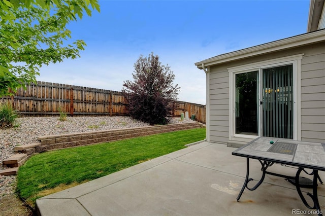 8071 Tabor St, Arvada, CO 80005 - fenced backyard with a patio area