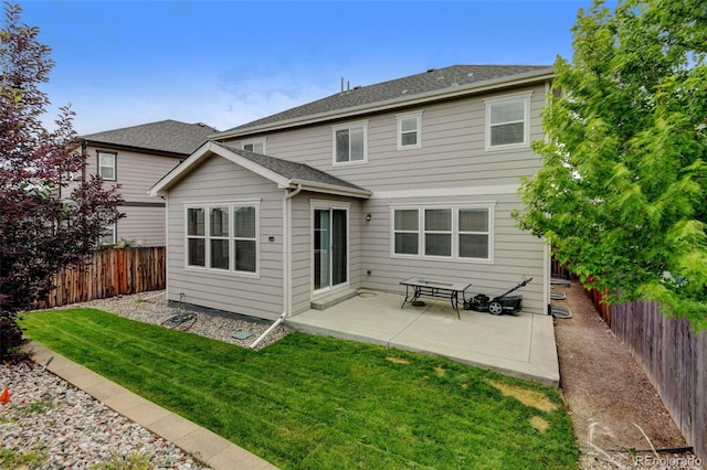 8071 Tabor St, Arvada, CO 80005 - back of house with a fenced backyard and a patio area