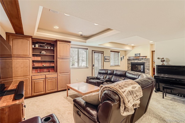 2369 Bayberry Ln, Castle Rock, CO 80104 - living room featuring light carpet, a fireplace, a raised ceiling, and recessed lighting