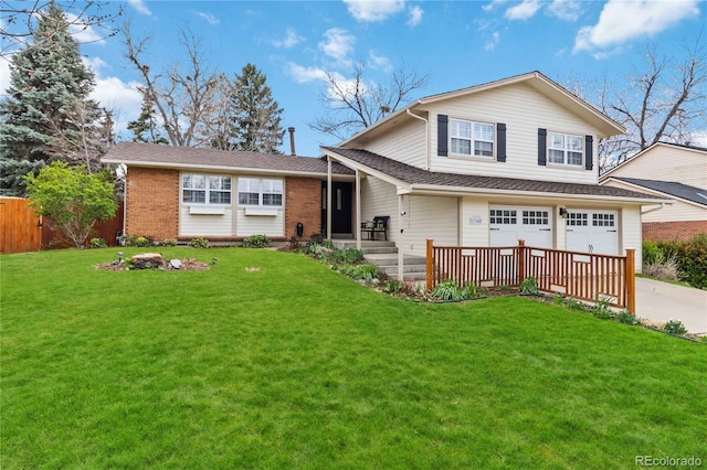 1768 E Jamison Ave, Centennial, CO 80122 - view of front of house with a garage, driveway, and brick siding