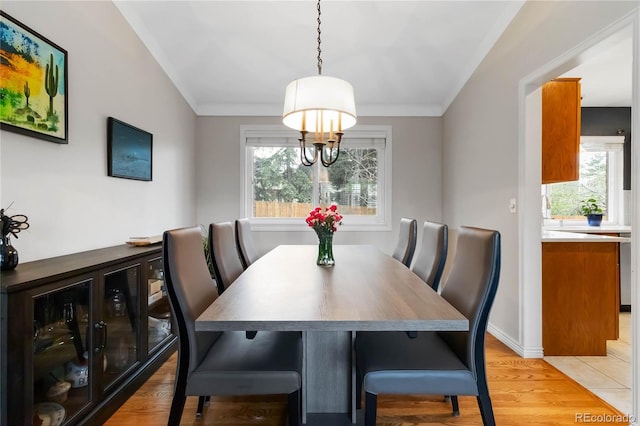 1768 E Jamison Ave, Centennial, CO 80122 - dining area with plenty of natural light, light wood finished floors, ornamental molding, and baseboards