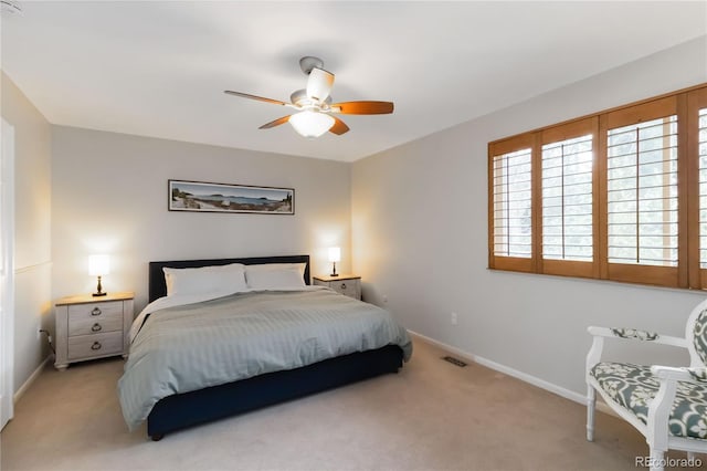 1768 E Jamison Ave, Centennial, CO 80122 - bedroom featuring multiple windows, baseboards, and light carpet