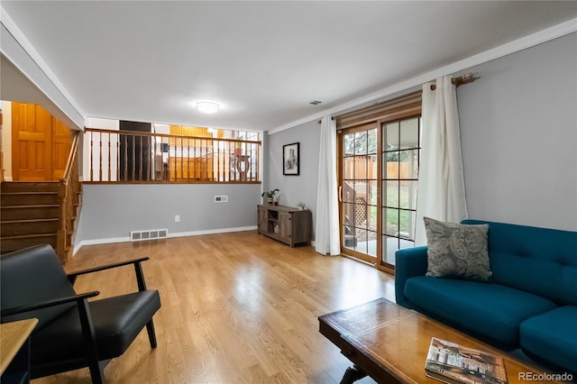 1768 E Jamison Ave, Centennial, CO 80122 - living room with stairs, wood finished floors, and baseboards