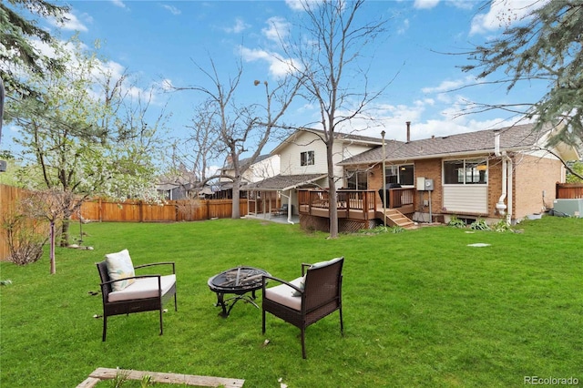 1768 E Jamison Ave, Centennial, CO 80122 - rear view of property with brick siding, an outdoor fire pit, a deck, and roof with shingles