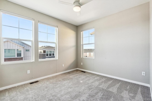 empty room with carpet and ceiling fan