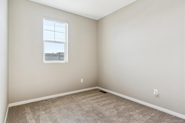 empty room featuring light colored carpet