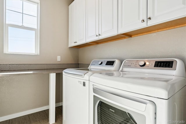 laundry area featuring cabinets and washing machine and clothes dryer