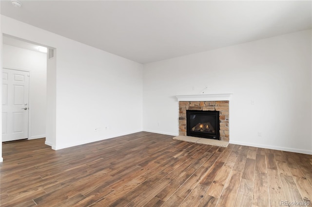 unfurnished living room with hardwood / wood-style floors and a fireplace