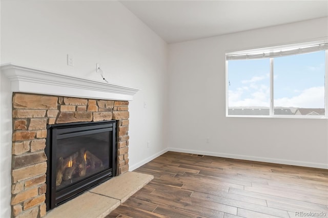 unfurnished living room with hardwood / wood-style floors