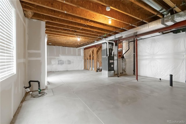 basement featuring heating unit