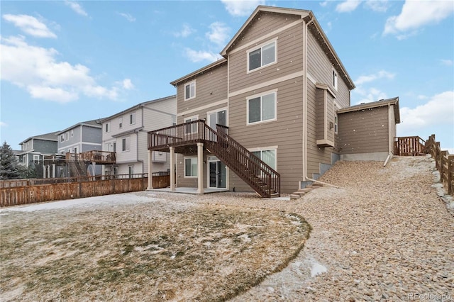 rear view of house with a deck