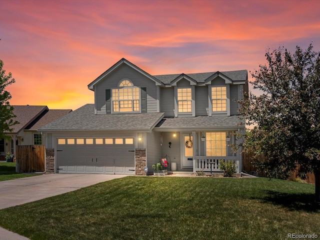 2006 E 97th Ave, Thornton, CO 80229 - traditional-style house featuring covered porch, driveway, roof with shingles, a garage, and stone siding