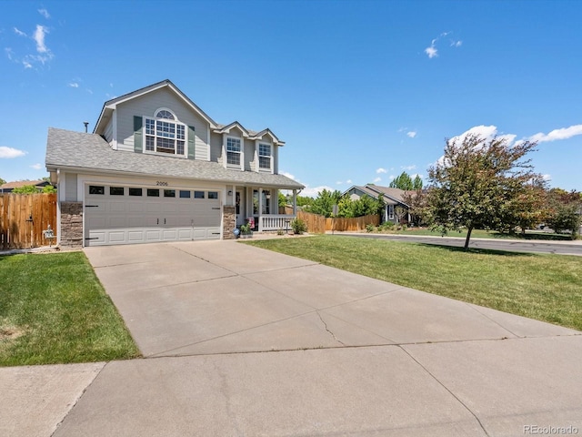 2006 E 97th Ave, Thornton, CO 80229 - view of front of property with concrete driveway, stone siding, a garage, and covered porch