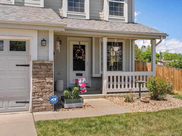 2006 E 97th Ave, Thornton, CO 80229 - doorway to property with a porch and roof with shingles