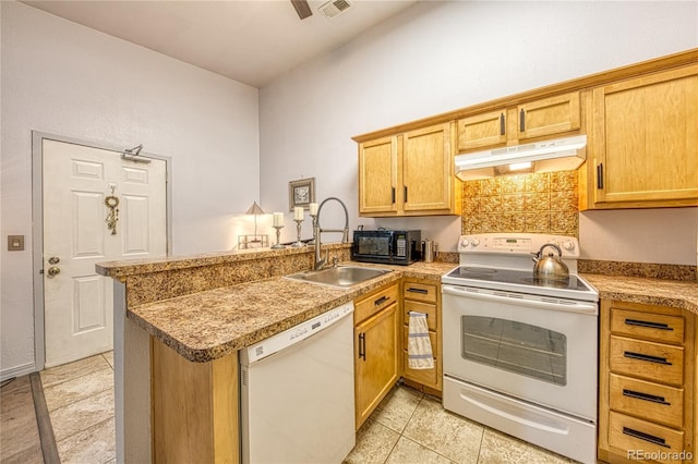 919 S Dawson Way Unit 17, Aurora, CO 80012 - kitchen featuring white appliances, under cabinet range hood, a peninsula, a sink, and light tile patterned flooring
