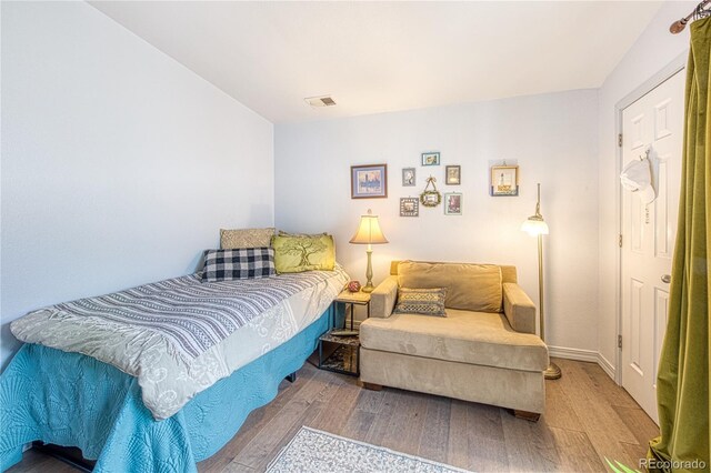 919 S Dawson Way Unit 17, Aurora, CO 80012 - bedroom featuring wood finished floors