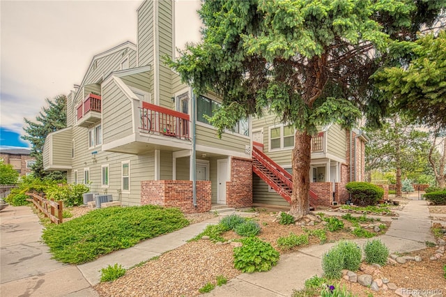 919 S Dawson Way Unit 17, Aurora, CO 80012 - view of property featuring central AC unit and stairway