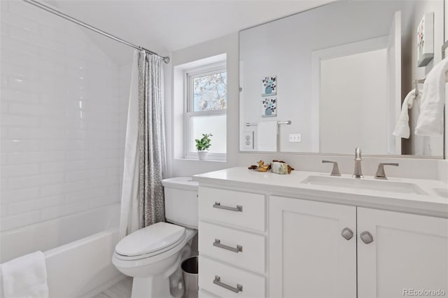 full bathroom with shower / tub combo with curtain, vanity, and toilet