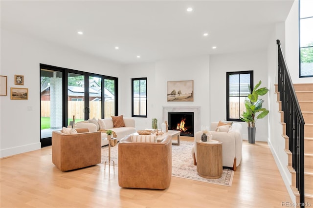 4452 Xavier St, Denver, CO 80212 - living area featuring light wood-style floors, plenty of natural light, recessed lighting, stairs, and a fireplace
