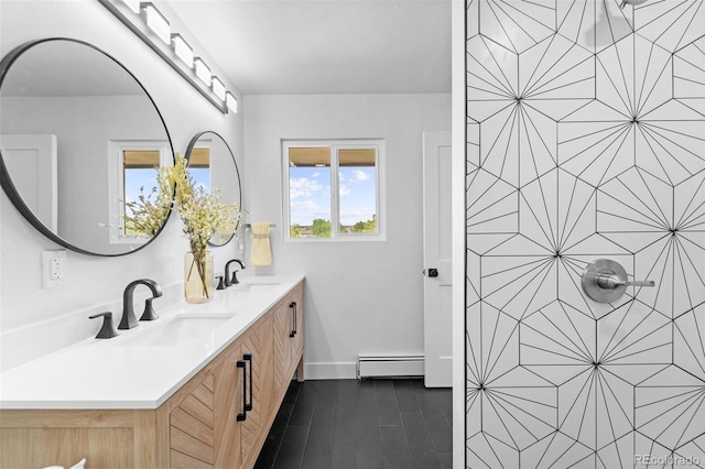 bathroom with vanity and baseboard heating