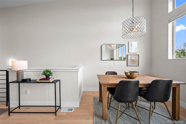 3480 E 31st Ave, Denver, CO 80205 - dining room featuring light wood-style floors and baseboards