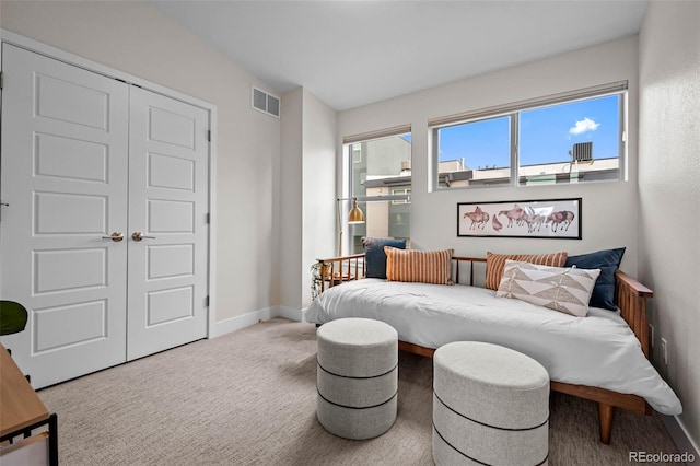 3480 E 31st Ave, Denver, CO 80205 - carpeted bedroom with baseboards and a closet