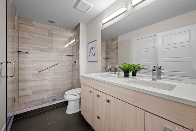 3480 E 31st Ave, Denver, CO 80205 - bathroom featuring a stall shower, double vanity, tile patterned floors, and toilet